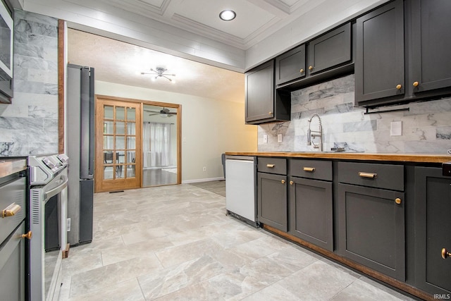 1453 Brookview Ave, Warsaw, IN 46580 - kitchen featuring appliances with stainless steel finishes, a sink, tasteful backsplash, ceiling fan, and coffered ceiling