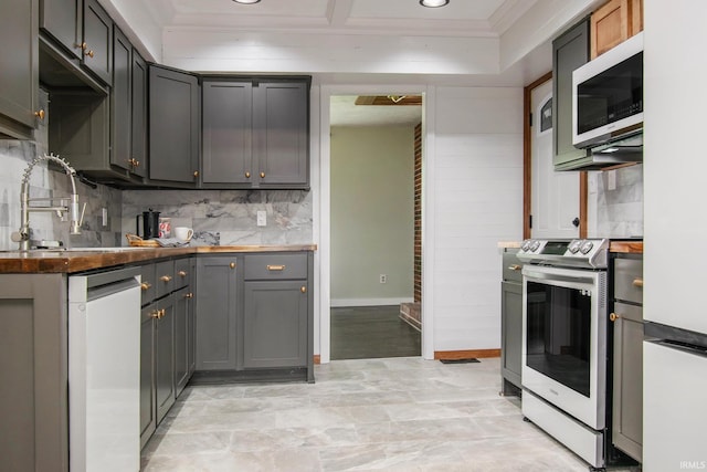 1453 Brookview Ave, Warsaw, IN 46580 - kitchen featuring white appliances, tasteful backsplash, crown molding, recessed lighting, and a sink