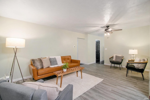 1453 Brookview Ave, Warsaw, IN 46580 - living room with light wood-type flooring, baseboards, and ceiling fan