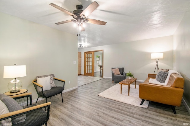 1453 Brookview Ave, Warsaw, IN 46580 - living area featuring light wood-type flooring, baseboards, and a ceiling fan