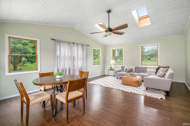 1453 Brookview Ave, Warsaw, IN 46580 - dining area with baseboards, vaulted ceiling, hardwood / wood-style floors, ceiling fan, and a skylight