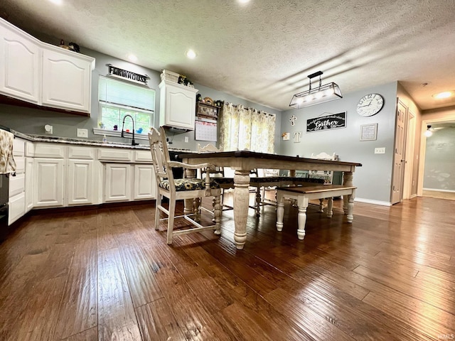 348 N Dover Clfs, Ellettsville, IN 47429 - kitchen with white cabinets, a sink, dark wood-type flooring, a textured ceiling, and recessed lighting