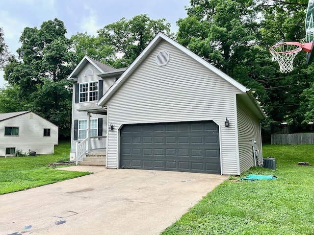 348 N Dover Clfs, Ellettsville, IN 47429 - traditional-style house with a front lawn, central air condition unit, and driveway