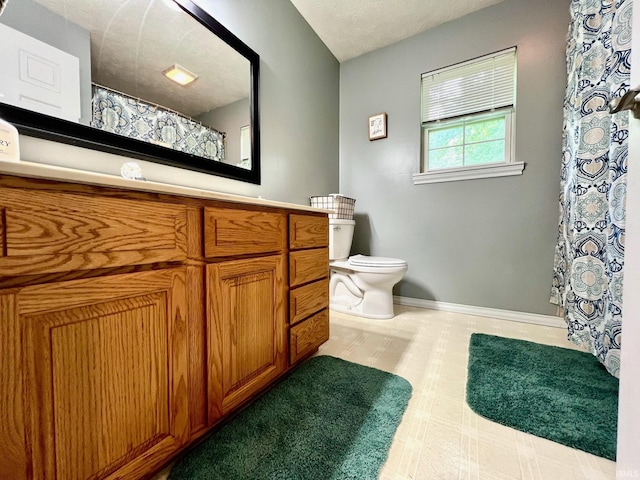 348 N Dover Clfs, Ellettsville, IN 47429 - bathroom with toilet, vanity, baseboards, and a shower with curtain