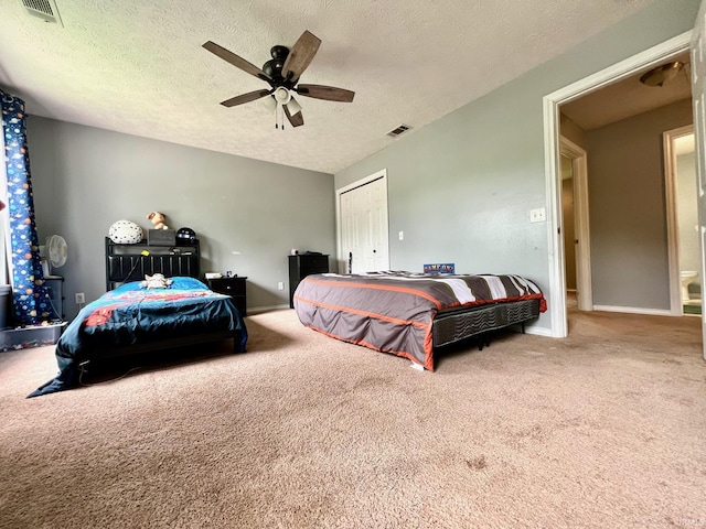 348 N Dover Clfs, Ellettsville, IN 47429 - bedroom with carpet, baseboards, a textured ceiling, ceiling fan, and a closet
