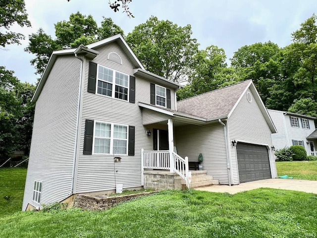 348 N Dover Clfs, Ellettsville, IN 47429 - view of front of house featuring a garage, a front yard, driveway, and roof with shingles