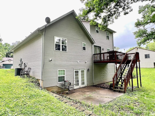 348 N Dover Clfs, Ellettsville, IN 47429 - rear view of property featuring a deck, a yard, a patio area, central AC unit, and stairway