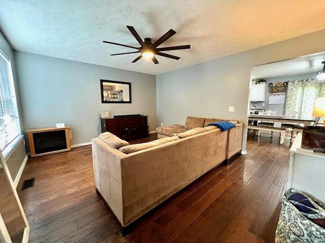 348 N Dover Clfs, Ellettsville, IN 47429 - living area featuring dark wood finished floors, a ceiling fan, and a textured ceiling