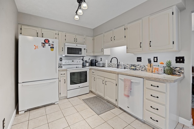 2218 Wake Robin Dr, West Lafayette, IN 47906 - kitchen with white appliances, a sink, and white cabinets