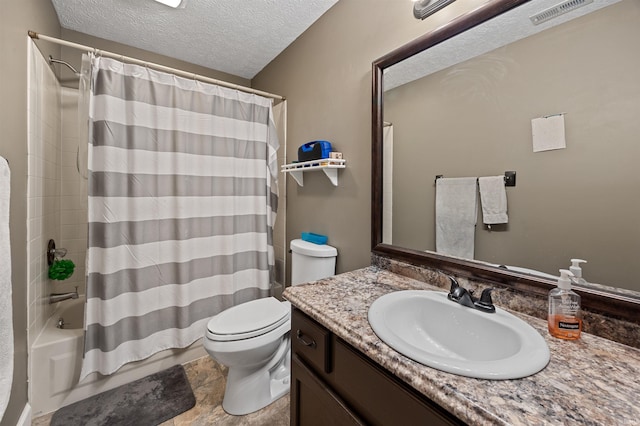 2218 Wake Robin Dr, West Lafayette, IN 47906 - bathroom featuring toilet, vanity, shower / tub combo with curtain, and a textured ceiling