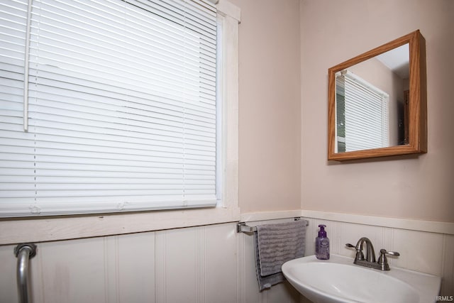 1416 State St, Vincennes, IN 47591 - bathroom with a sink, wainscoting, and a decorative wall