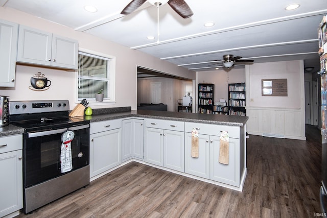 1416 State St, Vincennes, IN 47591 - kitchen featuring stainless steel electric range, ceiling fan, a peninsula, dark wood-style floors, and wainscoting