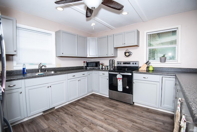 1416 State St, Vincennes, IN 47591 - kitchen featuring stainless steel appliances, dark wood-style floors, ceiling fan, dark countertops, and recessed lighting