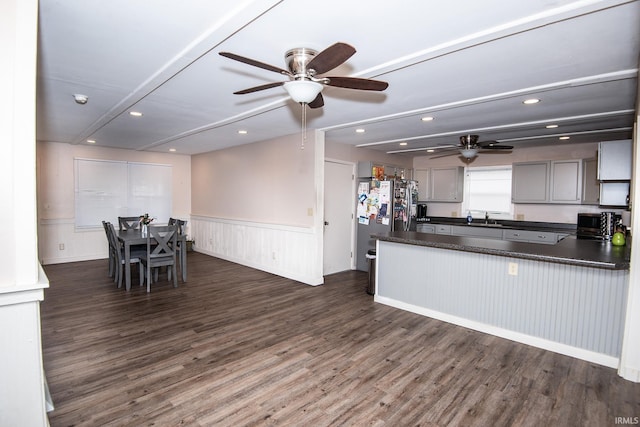 1416 State St, Vincennes, IN 47591 - kitchen with a sink, dark countertops, ceiling fan, dark wood finished floors, and wainscoting