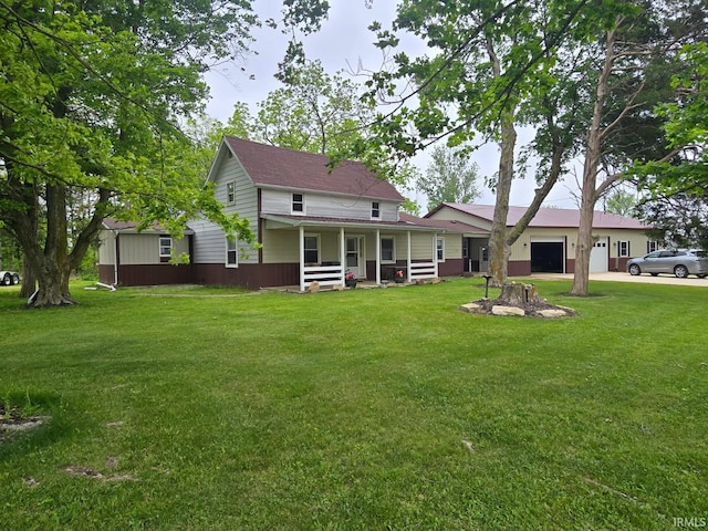 1591 W 100 N, Hartford City, IN 47348 - rear view of house with covered porch, an attached garage, a yard, driveway, and a shingled roof