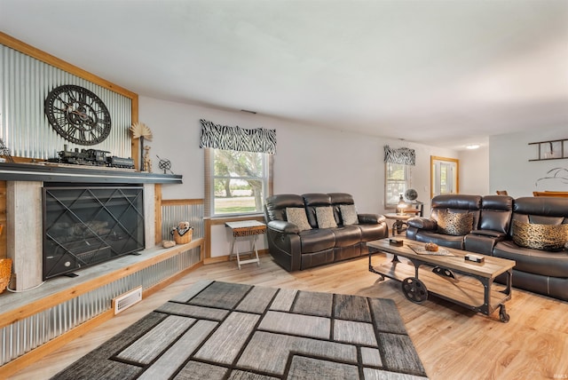 1591 W 100 N, Hartford City, IN 47348 - living area with wood finished floors and a fireplace with raised hearth