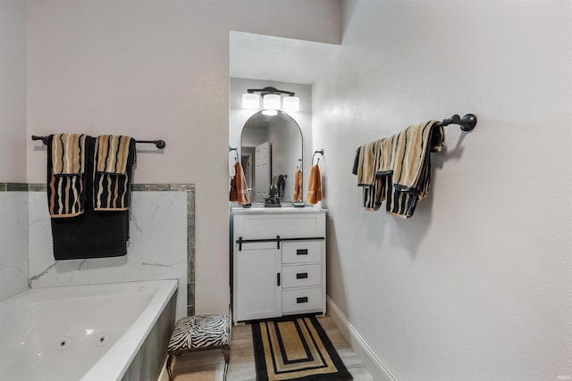 1591 W 100 N, Hartford City, IN 47348 - bathroom featuring vanity, wood finished floors, and a tub with jets