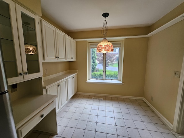 1327 Timberlake Rd, Evansville, IN 47710 - unfurnished dining area featuring baseboards and light tile patterned floors