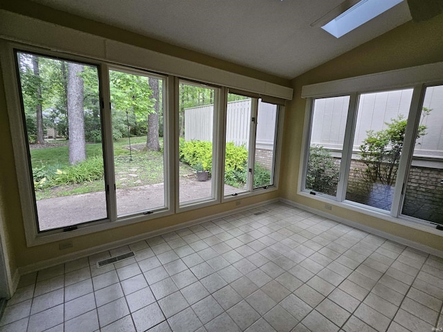 1327 Timberlake Rd, Evansville, IN 47710 - unfurnished sunroom with a skylight, lofted ceiling, plenty of natural light, and tile patterned floors