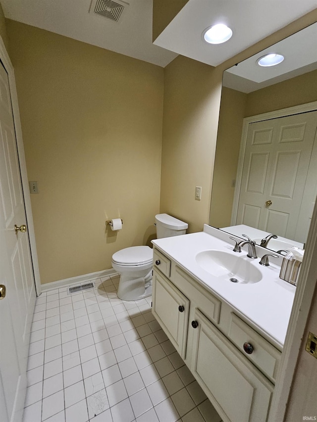 1327 Timberlake Rd, Evansville, IN 47710 - half bathroom with toilet, vanity, tile patterned floors, and baseboards