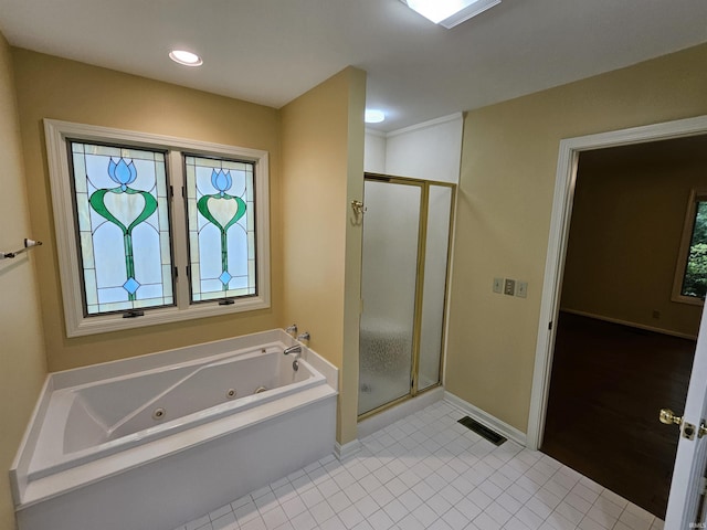 1327 Timberlake Rd, Evansville, IN 47710 - full bath with a stall shower, a jetted tub, tile patterned flooring, and baseboards