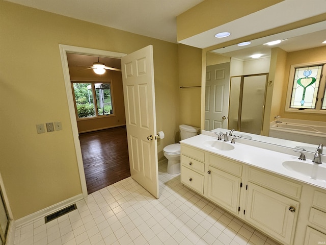 1327 Timberlake Rd, Evansville, IN 47710 - bathroom with a stall shower, a bath, toilet, baseboards, and tile patterned floors