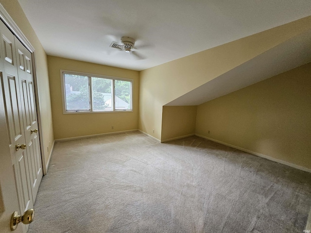 1327 Timberlake Rd, Evansville, IN 47710 - bonus room featuring a ceiling fan, light carpet, and baseboards