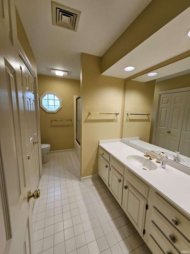 1327 Timberlake Rd, Evansville, IN 47710 - bathroom featuring toilet, vanity, tile patterned flooring, baseboards, and combined bath / shower with glass door