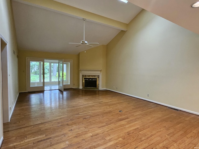 1327 Timberlake Rd, Evansville, IN 47710 - unfurnished living room featuring ceiling fan, beamed ceiling, wood finished floors, baseboards, and high vaulted ceiling