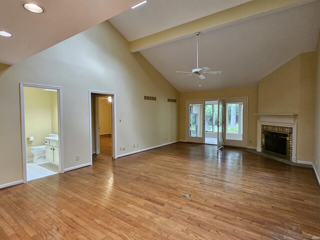 1327 Timberlake Rd, Evansville, IN 47710 - unfurnished living room with high vaulted ceiling, a ceiling fan, a brick fireplace, baseboards, and light wood finished floors
