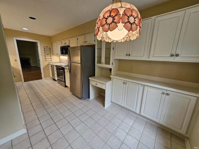 1327 Timberlake Rd, Evansville, IN 47710 - kitchen with appliances with stainless steel finishes, light countertops, light tile patterned floors, recessed lighting, and white cabinets