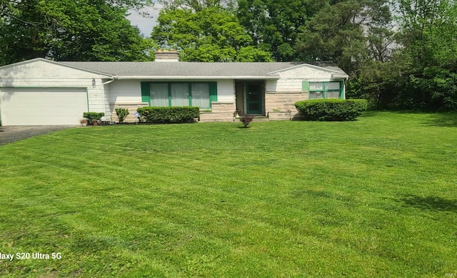 1202 N Sheridan Rd, Marion, IN 46952 - ranch-style home with driveway, a garage, a front lawn, and a chimney
