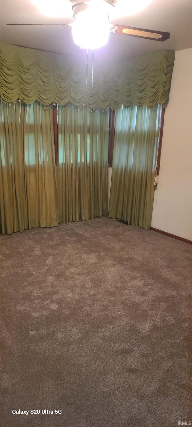 1202 N Sheridan Rd, Marion, IN 46952 - spare room with carpet floors, a ceiling fan, and baseboards