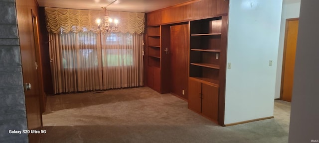 1202 N Sheridan Rd, Marion, IN 46952 - unfurnished dining area featuring carpet and a chandelier