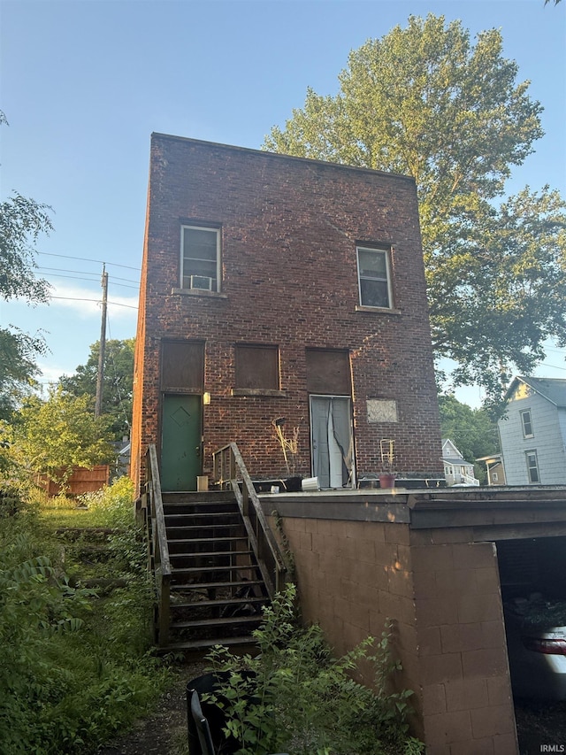 927 Erie Ave, Logansport, IN 46947 - back of house featuring brick siding and stairs