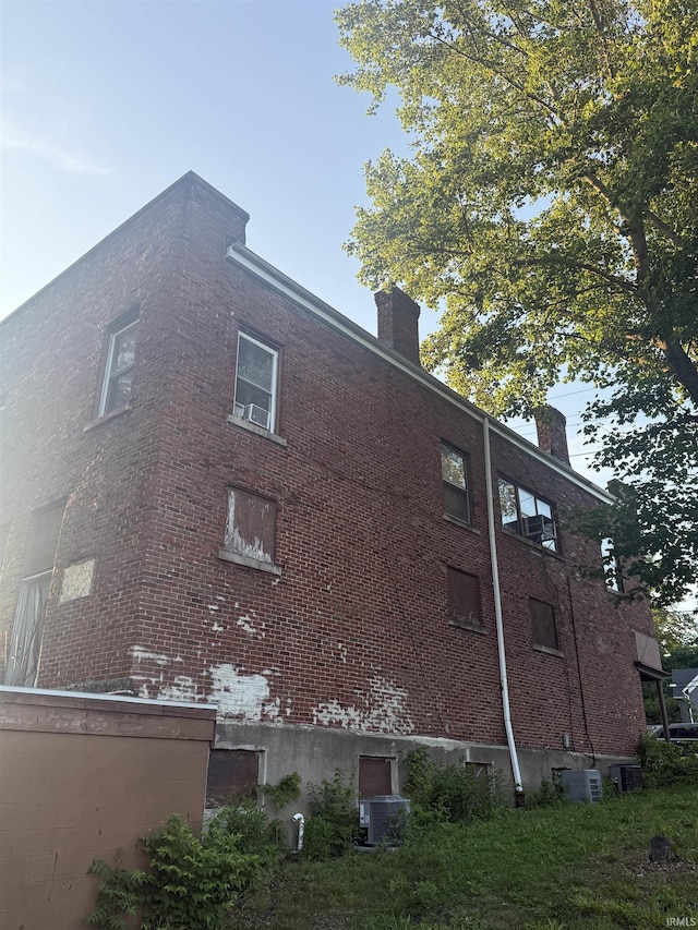 927 Erie Ave, Logansport, IN 46947 - view of property exterior featuring a chimney and brick siding
