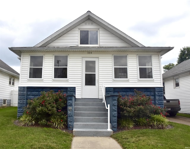 344 W 4th St, Jasper, IN 47546 - view of front of house featuring a front yard and entry steps