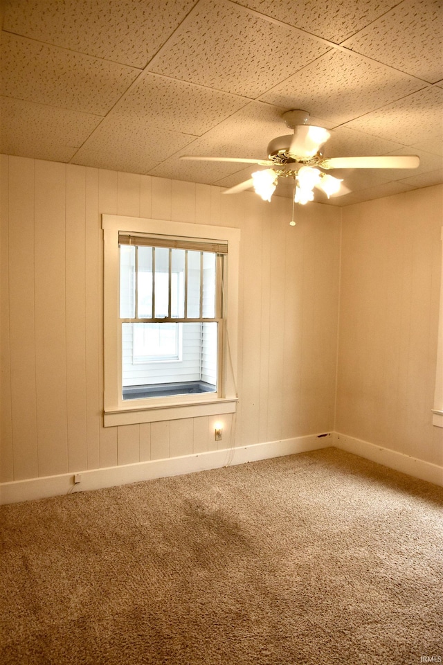 344 W 4th St, Jasper, IN 47546 - carpeted spare room featuring a ceiling fan, a drop ceiling, and baseboards
