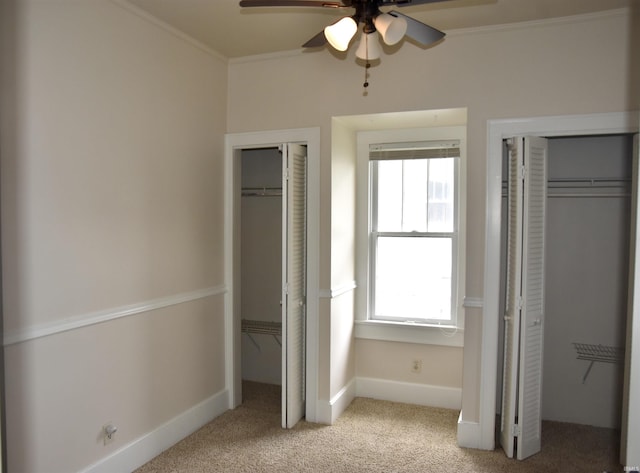 344 W 4th St, Jasper, IN 47546 - unfurnished bedroom with multiple closets, carpet, multiple windows, and ornamental molding