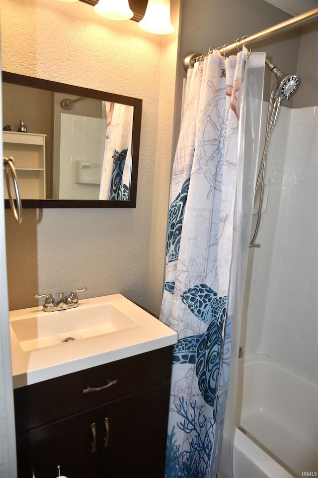 344 W 4th St, Jasper, IN 47546 - bathroom with vanity, shower / bath combo with shower curtain, and a textured wall