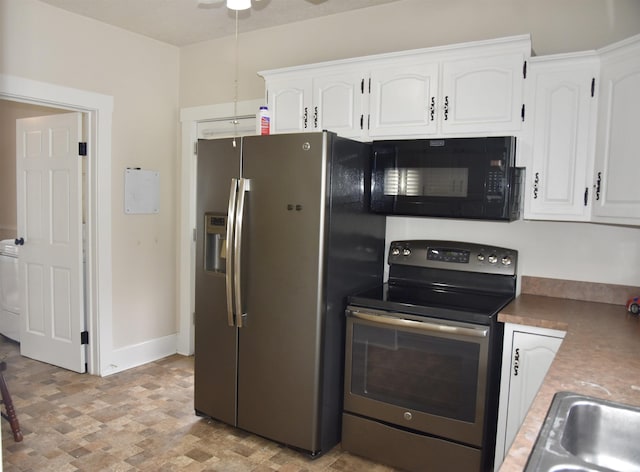 344 W 4th St, Jasper, IN 47546 - kitchen with appliances with stainless steel finishes, washer / clothes dryer, white cabinetry, and a ceiling fan