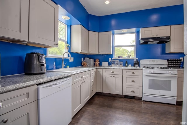 1113 Harrison St, Walkerton, IN 46574 - kitchen featuring white appliances, under cabinet range hood, a sink, healthy amount of natural light, and recessed lighting