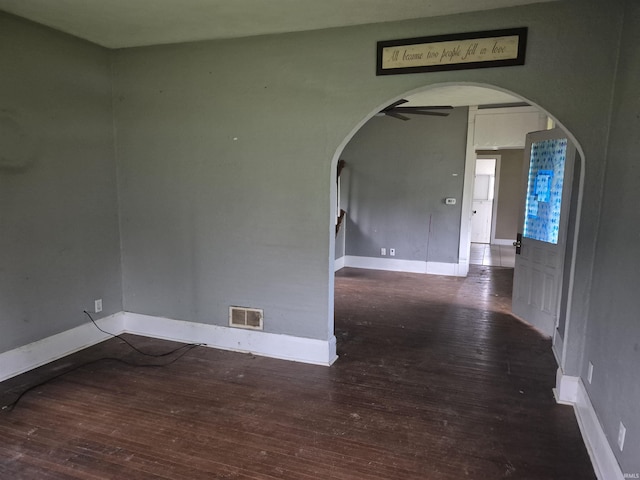 435 N Main St, Mulberry, IN 46058 - empty room featuring arched walkways, hardwood / wood-style flooring, baseboards, and a ceiling fan