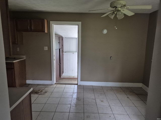 435 N Main St, Mulberry, IN 46058 - unfurnished dining area with ceiling fan, baseboards, and light tile patterned flooring
