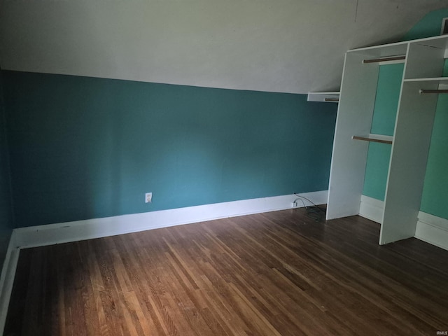 435 N Main St, Mulberry, IN 46058 - unfurnished bedroom with lofted ceiling, wood finished floors, baseboards, and a closet