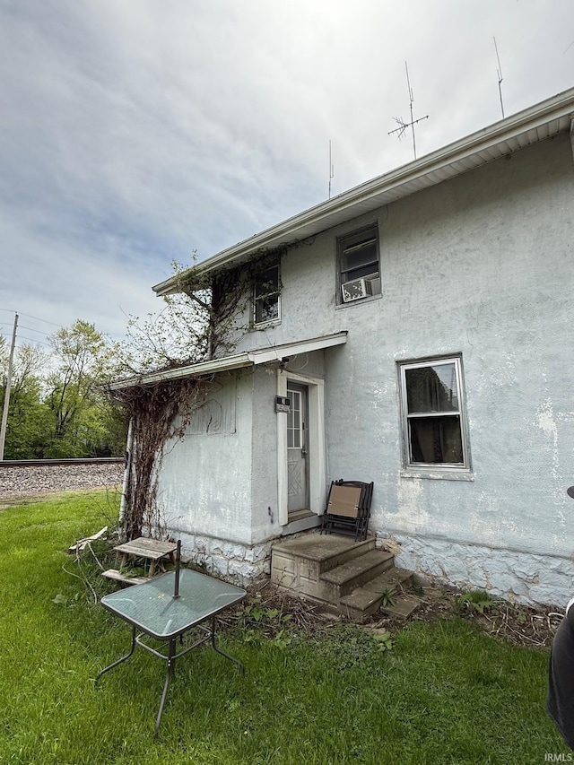11 Water St, Huntington, IN 46750 - back of house featuring a yard and stucco siding