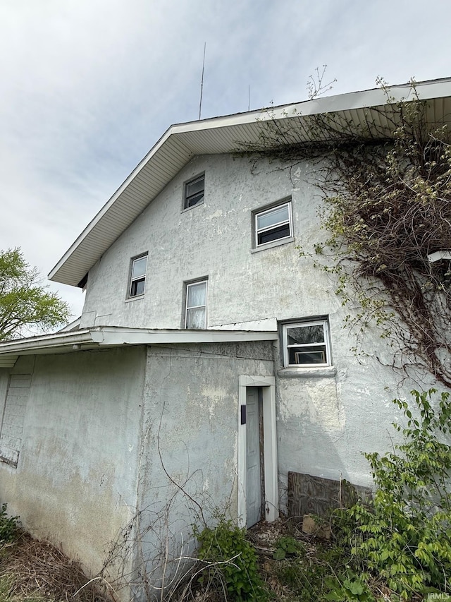 11 Water St, Huntington, IN 46750 - view of property exterior featuring stucco siding