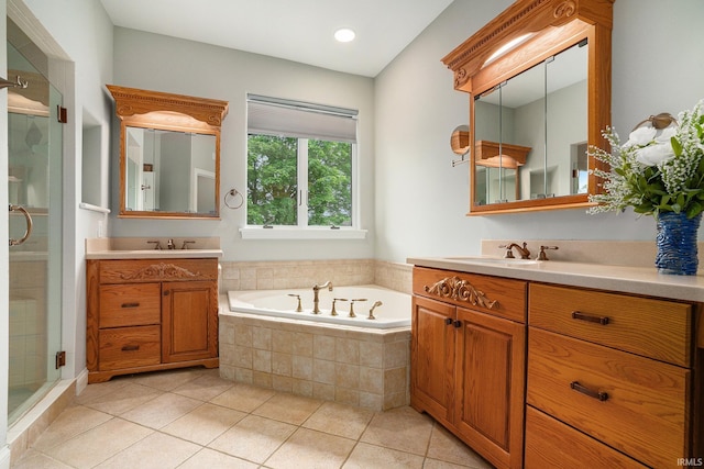 20870 N River Ridge Drive, Bristol, IN 46507 - bathroom featuring two vanities, a stall shower, a bath, and tile patterned floors