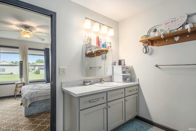 1635 Clover Creek Ln, Goshen, IN 46526 - bathroom featuring vanity, baseboards, and ceiling fan