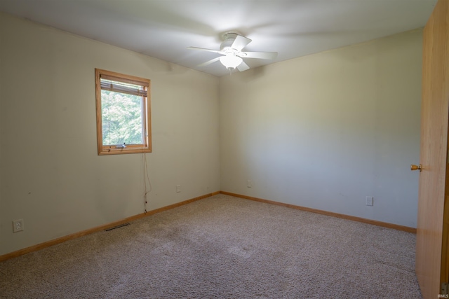 7768 S 100 W, North Judson, IN 46366 - carpeted spare room with a ceiling fan and baseboards